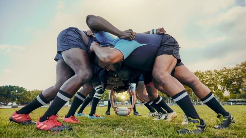 Group of men playing rugby