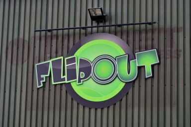 'Flip Out' logo in green on side of building