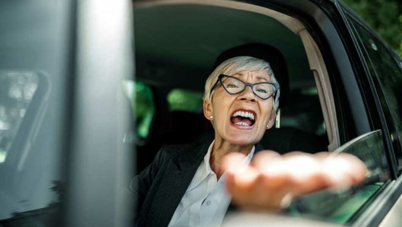 Woman shouting out of car