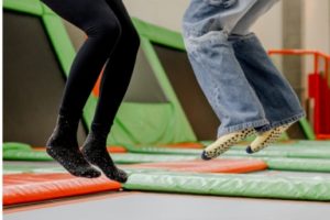 People bouncing on trampoline